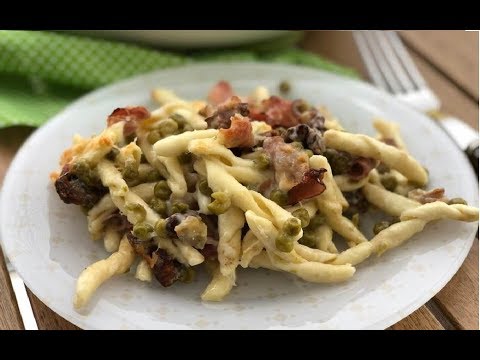 Pasta speck e piselli: l’esplosione di gusto con un tocco di pomodoro